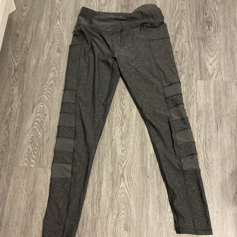 Gray Gottex leggings with mesh cutouts